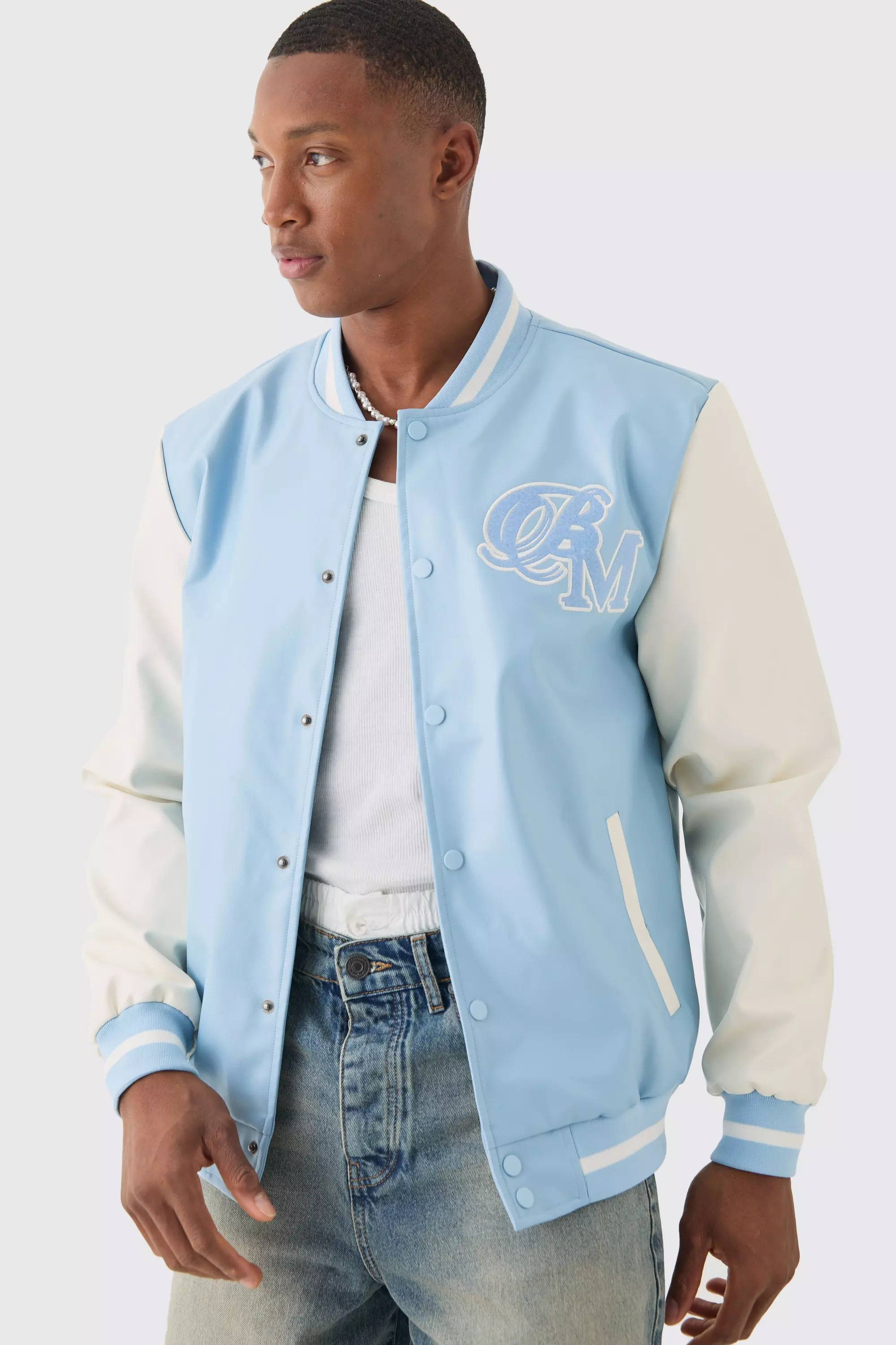 PU Badge Varsity Jacket In Light Blue boohooMAN